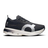 Women's On Cloudboom Strike road running shoes in black with orange accents, featuring breathable mesh upper and cushioned sole.