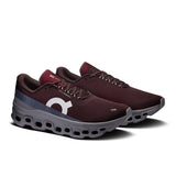 Men's On Cloudmonster 1 running shoes in gray and black with cushioned soles, designed for active life and running comfort.