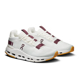 On Cloudnova 2 women's active lifestyle sneakers in black with white accents, featuring a cushioned sole and sporty design.