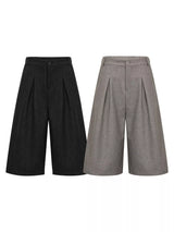 Men's high-waisted pleated wide-leg capri pants from Trendsi, shown in a relaxed fit with pleats and wide-leg design.