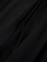 Men's wide-leg drawstring pants from Trendsi, featuring a relaxed fit and adjustable waist, shown in a neutral fabric.