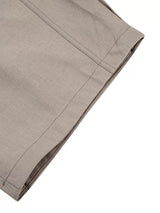 Men's high-waisted wide-leg pleated casual pants in neutral fabric, stylish and comfortable for everyday wear.
