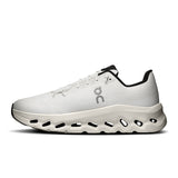 Men's On Cloudtilt Active Life sneakers in black and gray with textured soles and sleek design, perfect for active wear.