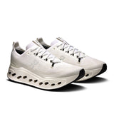 Men's On Cloudsurfer Max road running shoe with lightweight design and cushioned sole, featuring a sleek gray and blue color scheme.