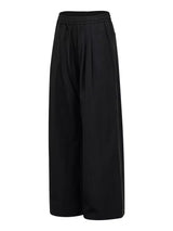 Men's wide-leg drawstring pants by Trendsi, showing relaxed fit with adjustable waistband and lightweight fabric.