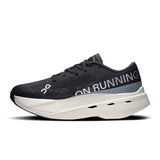 On Cloudboom Volt women's road running shoe with a sleek black and white design, featuring lightweight cushioning and responsive sole.