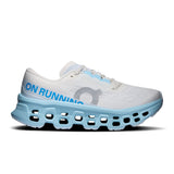 Women's On Cloudmonster 3 road running shoes in black with white accents, featuring cushioned soles and breathable mesh upper.