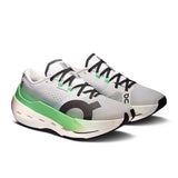 Women's On Cloudboom Max road running shoes shown in black with white accents, featuring a lightweight design and cushioned sole.