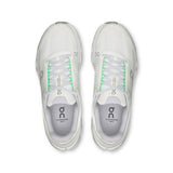 Women's On Cloudsurfer Next road running shoes in gray with blue accents, featuring cushioning and breathable mesh uppers.
