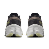 Women’s On Cloudmonster 3 road running shoes with cushioned soles and breathable mesh upper, designed for comfort and performance.