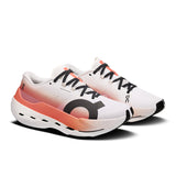 Women's On Cloudboom Max road running shoes with breathable mesh uppers and cushioned soles, designed for high-performance running.
