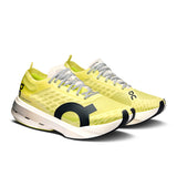 Women's On Cloudboom Strike road running shoes in black and white with breathable mesh upper and cushioned sole.