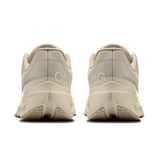 Women's On Cloudsurfer Next road running shoes in gray and pink, featuring lightweight design and cushioned soles.