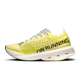 Women's On Cloudboom Strike road running shoes with lightweight design and sporty orange and black color scheme.
