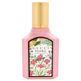 Gucci Flora Gorgeous Gardenia 1 oz Eau de Parfum spray bottle with floral branding and elegant packaging.