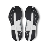 On Cloudsurfer Next women's road running shoes in white and blue, featuring cushioned soles and sleek athletic design.