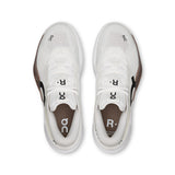 On THE ROGER Pro 3 women's tennis shoes in white with black accents, featuring cushioned soles and breathable mesh upper.