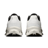 On Cloudtilt men's active life shoes in black with white accents, showing side view and breathable mesh upper.