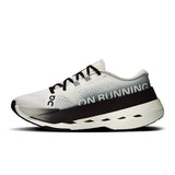 Women's On Cloudboom Max road running shoes with breathable mesh upper and cushioned sole for high-performance running.