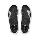 Women's On Cloudboom Volt road running shoes in black and orange with cushioning and breathable mesh upper.