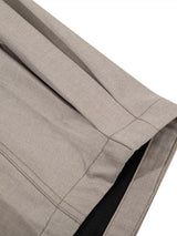 Men's high-waisted wide-leg pleated casual pants by Trendsi, featuring relaxed fit and stylish design in neutral fabric.