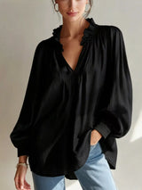 Trendsi frill notched long sleeve blouse featuring ruffled details and a stylish collar, displayed on a white background.