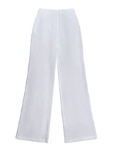 Decorative button smocked back cami and wide-leg pants set by Trendsi, featuring a stylish, coordinated outfit with a smocked top and flowy pants.
