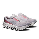 Women's On Cloudmonster 3 road running shoes in gray and black with cushioned soles and breathable mesh upper.