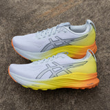 Men's ASICS GEL-Kayano 32 stability trainers in a sunny Sizzle colorway, featuring supportive design and athletic style.
