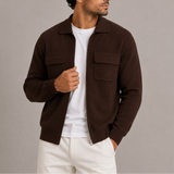 Men’s zip-up knit jacket by Zexov featuring a collar and chest pockets, shown in a close-up image highlighting the fabric and design details.