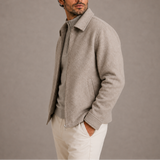 Men's Zexov collared zip-up jacket in black, featuring a front zipper, ribbed cuffs, and a classic collar style.