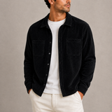 Men’s Zexov corduroy overshirt jacket with long sleeves and button-up front, displayed on a hanger showing its textured fabric.