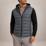 Men's lightweight puffer jacket with hood by Zexov, showcasing the padded design and comfortable fit in a casual outdoor setting.