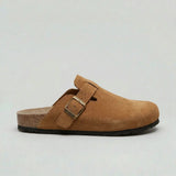Men’s suede slip-on clogs by Zexov with adjustable buckle and comfortable design, shown in a natural side view.