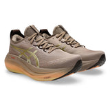 Men's ASICS GEL-Nimbus 27 LUXE neutral daily trainers in taupe grey with sleek design and cushioned sole.
