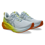 Men's ASICS Novablast 5 neutral daily trainers in sky lemon color with lightweight mesh upper and cushioned midsole.