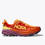 Women’s Hoka Speedgoat 6 shoes in sherbert and beetroot colors, showing the trail running shoe with supportive design and textured outsole.