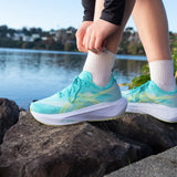 Unisex ASICS Megablast energy aqua blue fade tempo trainers with breathable mesh upper and cushioned sole.