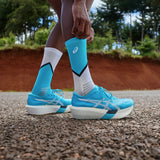 Unisex ASICS Metaspeed Sky Tokyo road racing shoes in white with blue accents, designed for high-speed running.