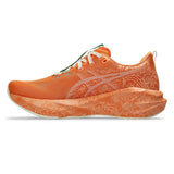 Unisex ASICS Novablast 5 Tokyo neutral daily trainers in sun peach and white with breathable mesh upper and cushioned sole.