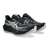 Unisex ASICS Superblast 3 neutral daily trainers in black with a sleek design and cushioned sole for comfortable running.