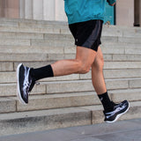 Unisex ASICS Superblast 3 neutral daily trainers in black with a sleek design and cushioned sole for comfortable running.