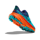 Women's Hoka Challenger ATR 7 wide running shoes in vibrant orange with ceramic accents, designed for trail and outdoor activities.