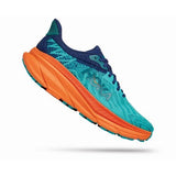 Hoka Challenger ATR 7 women's wide running shoes in vibrant orange with ceramic accents, featuring breathable mesh and cushioned soles.