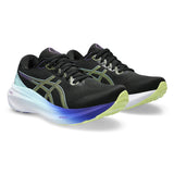 Women's ASICS GEL-Kayano 30 stability trainers in black with glow yellow accents, featuring cushioned athletic design.