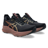 Women's ASICS GEL-Kayano 32 stability trainers in black and dark currant with supportive design and cushioned sole.
