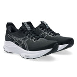 Women's ASICS GEL-Kayano 32 stability trainers in black and white, featuring a supportive design with cushioned soles.