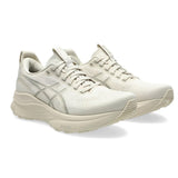 Women's ASICS GEL-Kayano 32 stability trainers in oatmeal and meteor grey, showing side view with cushioned sole and supportive design.