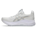 Women's ASICS GEL-Kayano 32 stability trainers in white and champagne with supportive cushioning and sleek design.