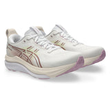 Women's ASICS GEL-Kayano 33 wide stability trainers in white and hazy lilac, featuring supportive cushioning and athletic design.